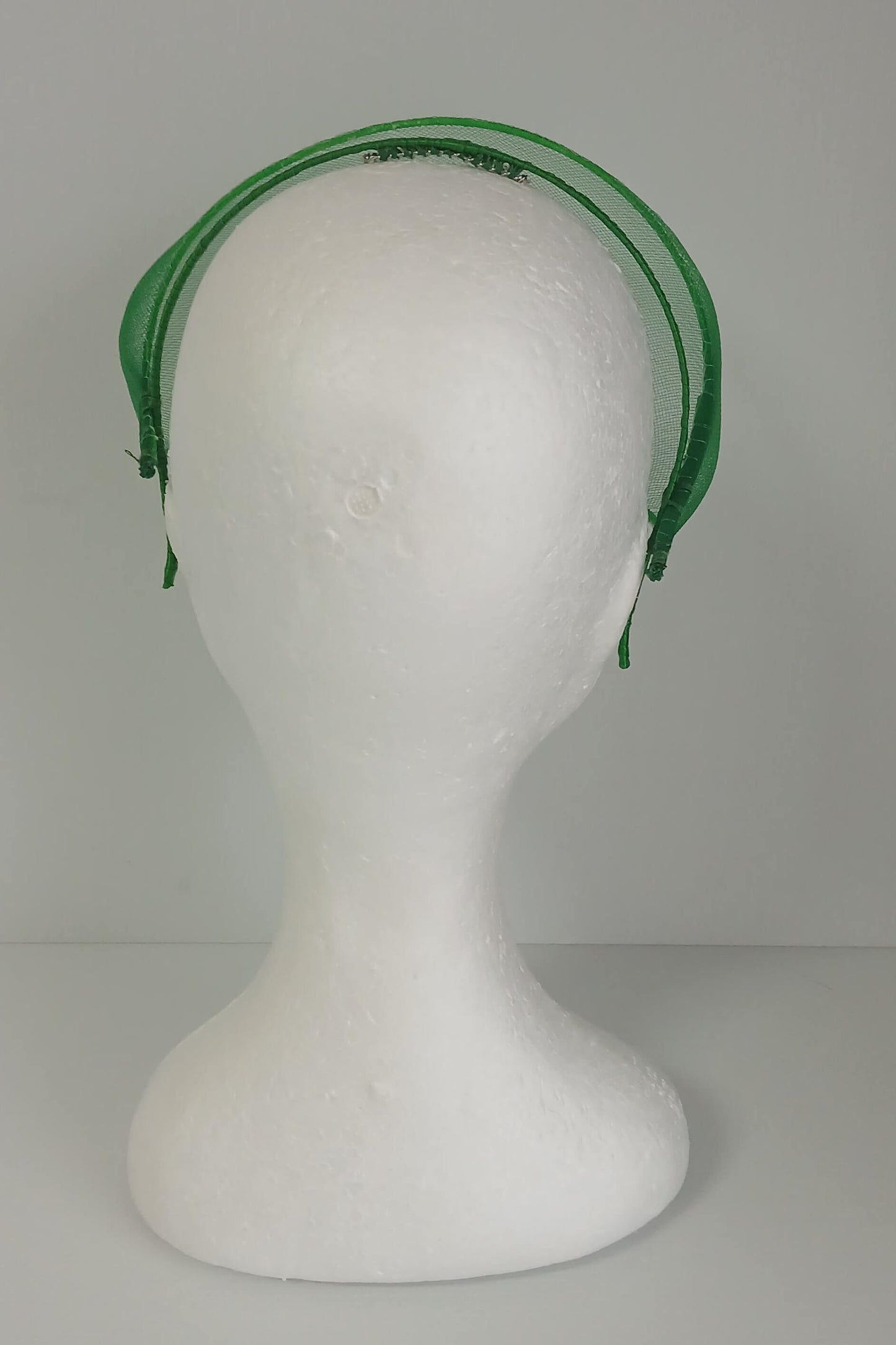 A picture of a green crinoline millinery crown by Melissa Rath Millinery