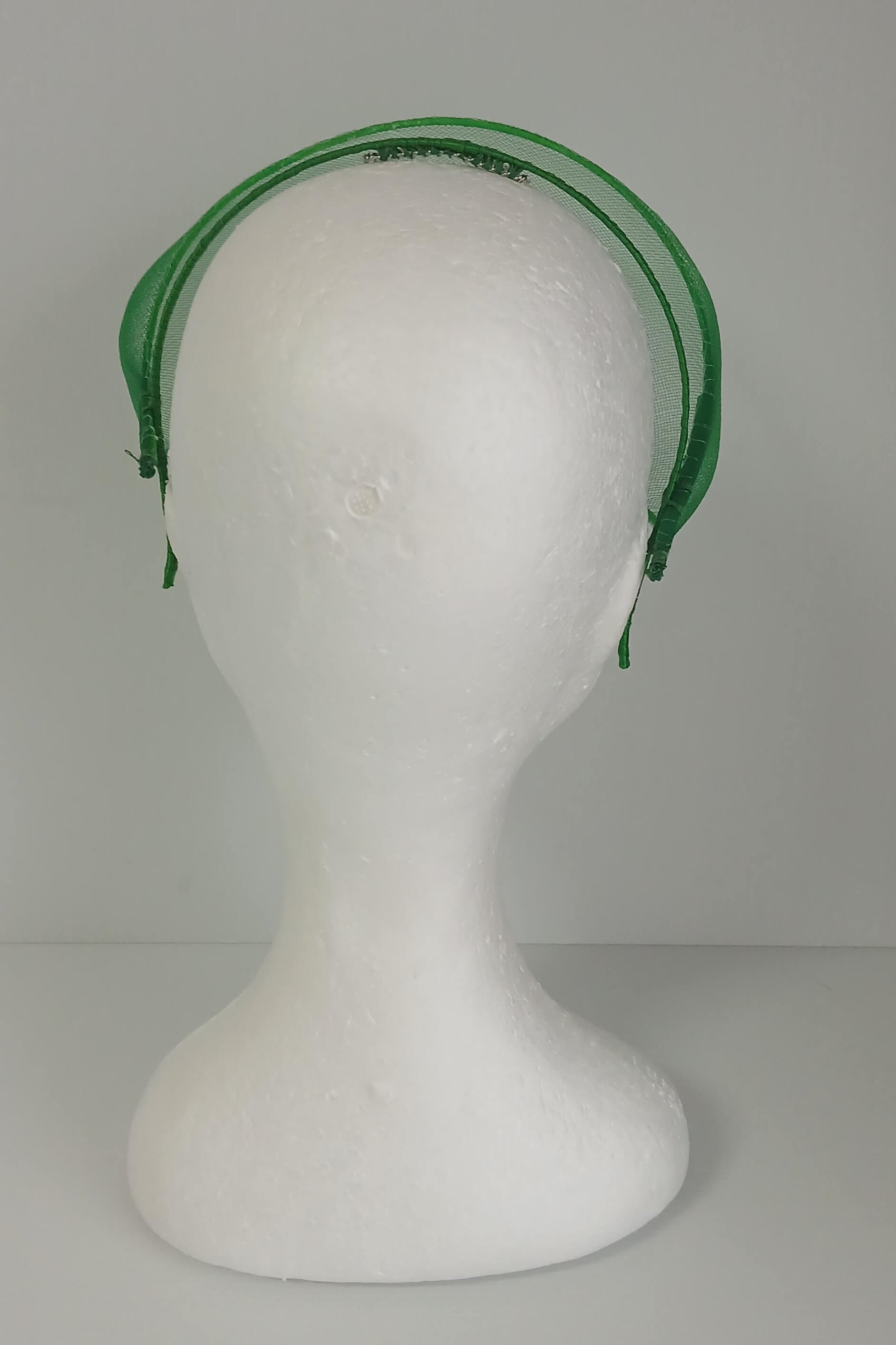 A picture of a green crinoline millinery crown by Melissa Rath Millinery