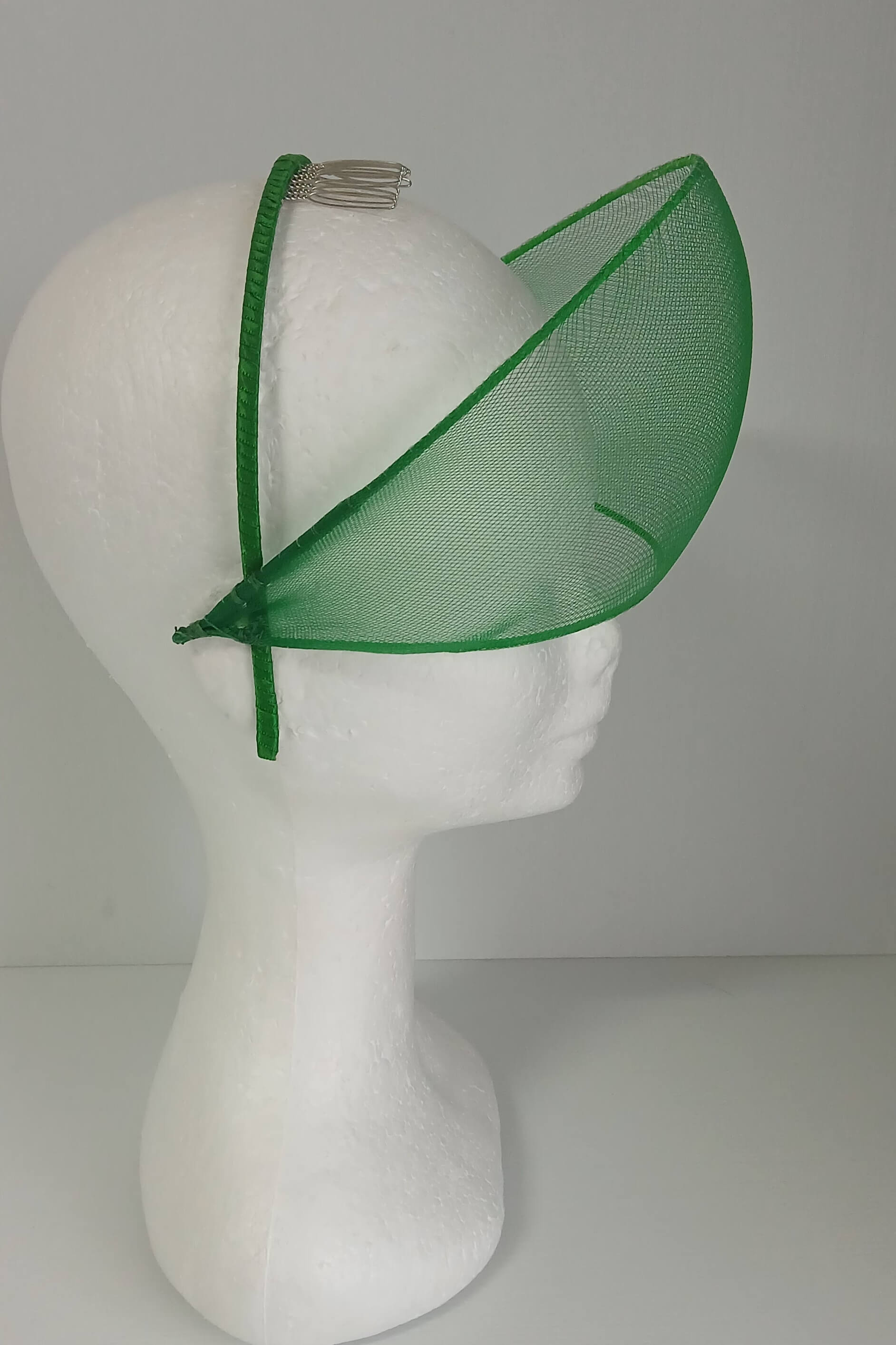 A picture of a green crinoline millinery crown by Melissa Rath Millinery