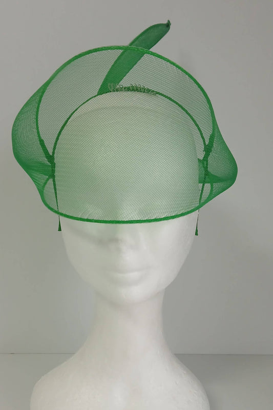 A picture of a green crinoline veil with Swirls by Melissa Rath Millinery