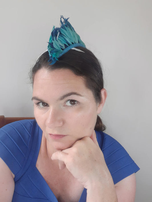 A picture of a Blue and Green Feathered Millinery Mohawk by Melissa Rath Millinery.