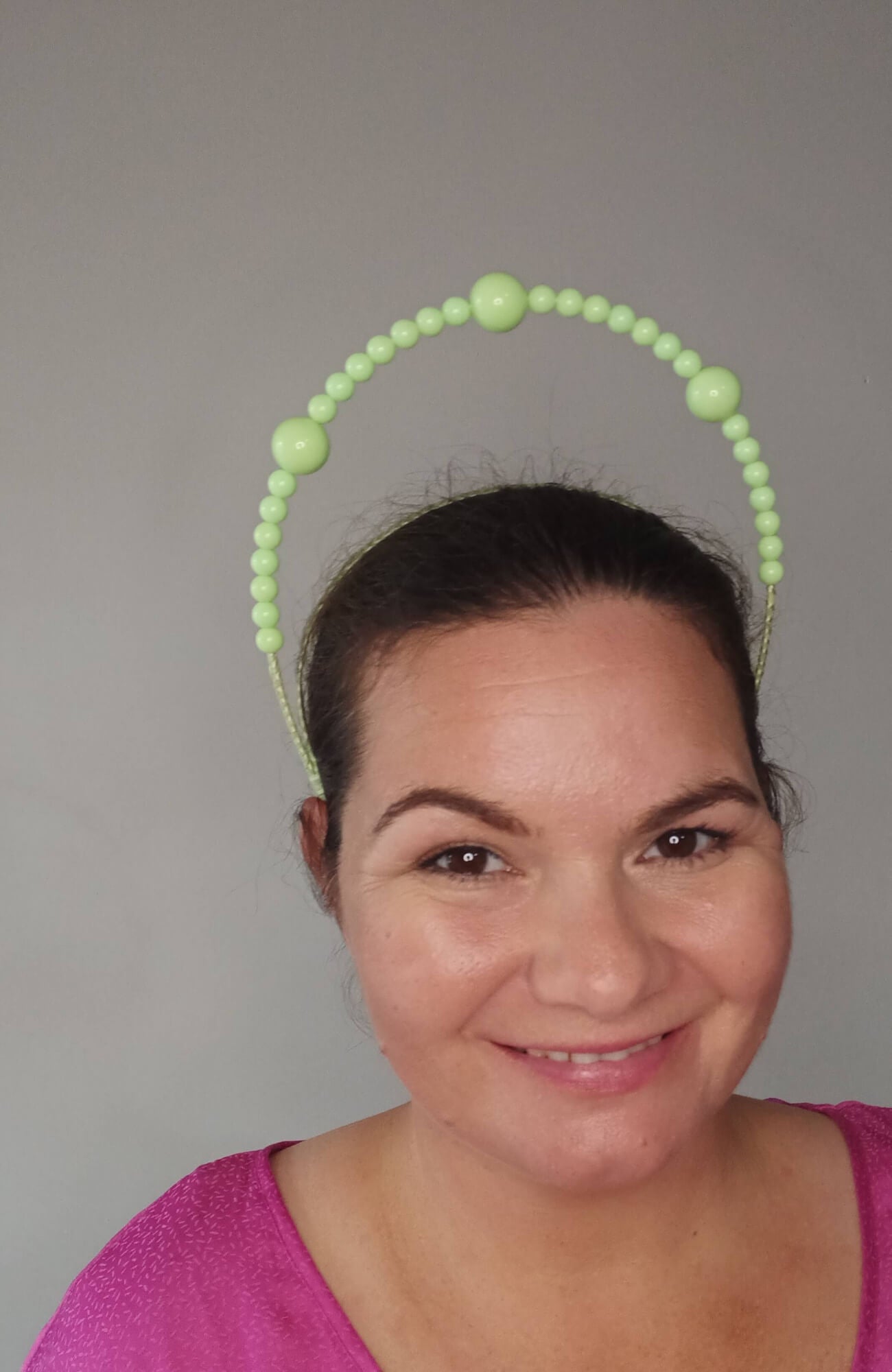 A picture of a Green Beaded Millinery Headband by Melissa Rath Millinery.