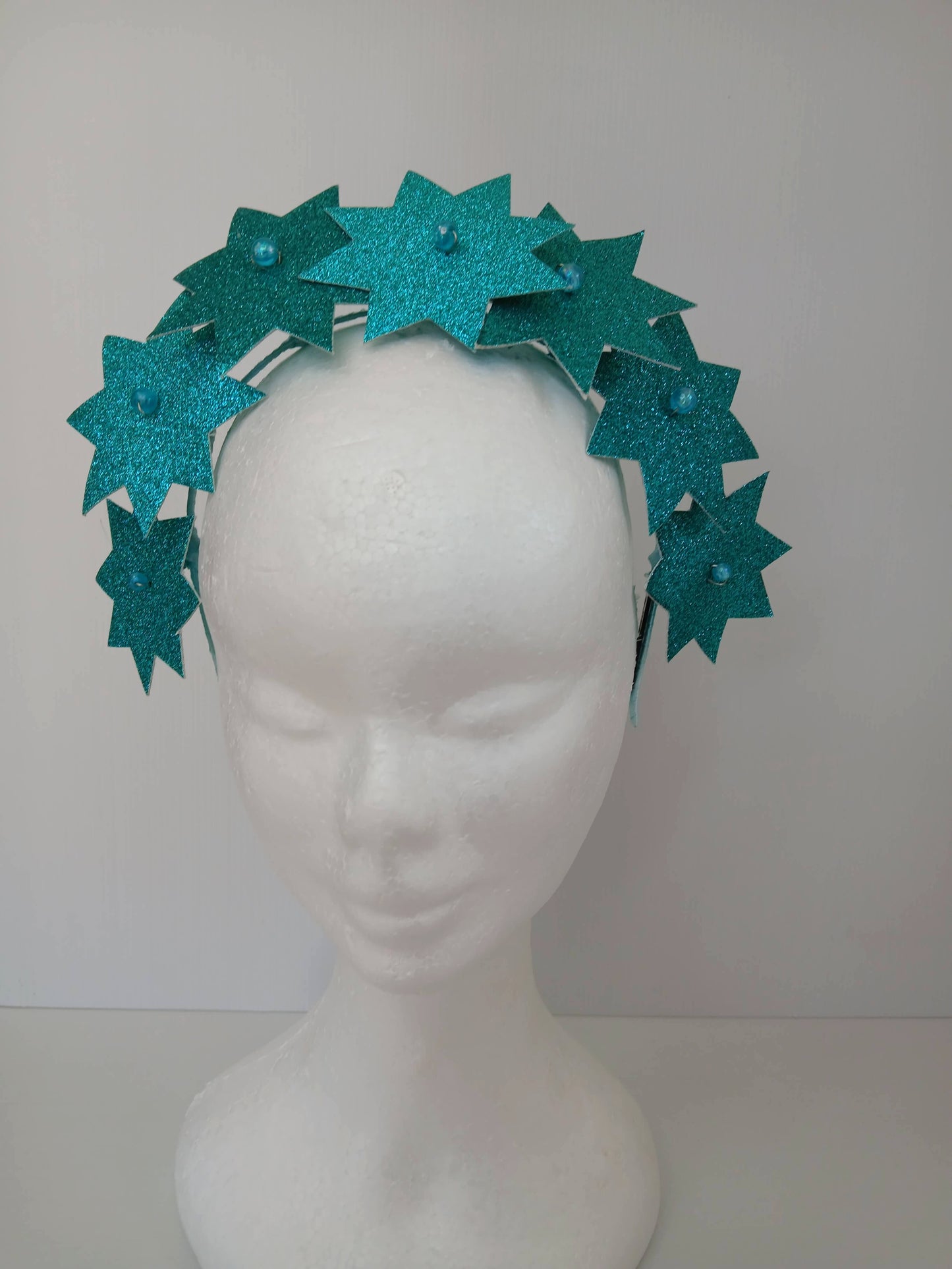 A picture of a Green Pleather Millinery Headband by Melissa Rath Millinery