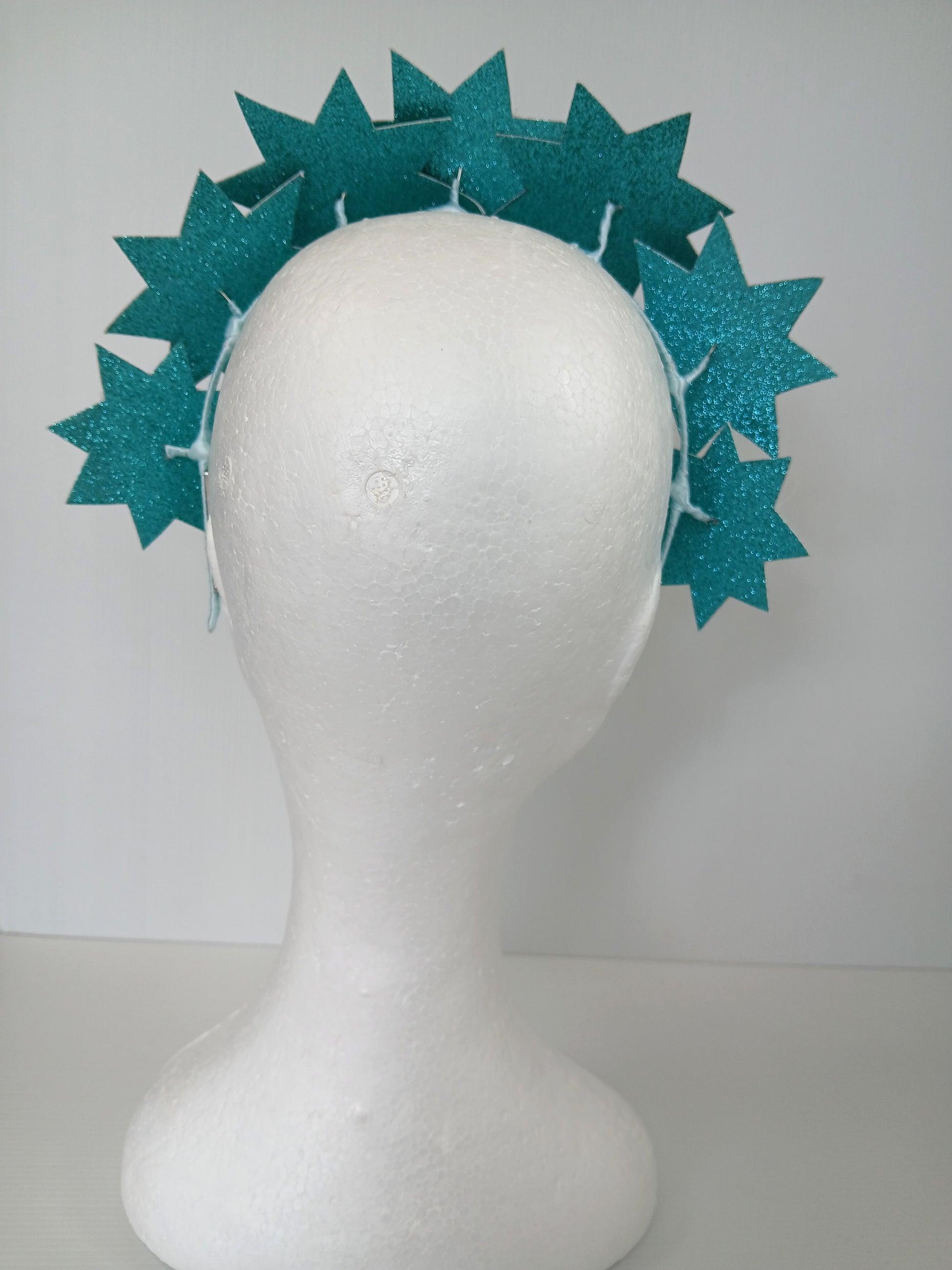 A picture of a Green Pleather Millinery Headband by Melissa Rath Millinery