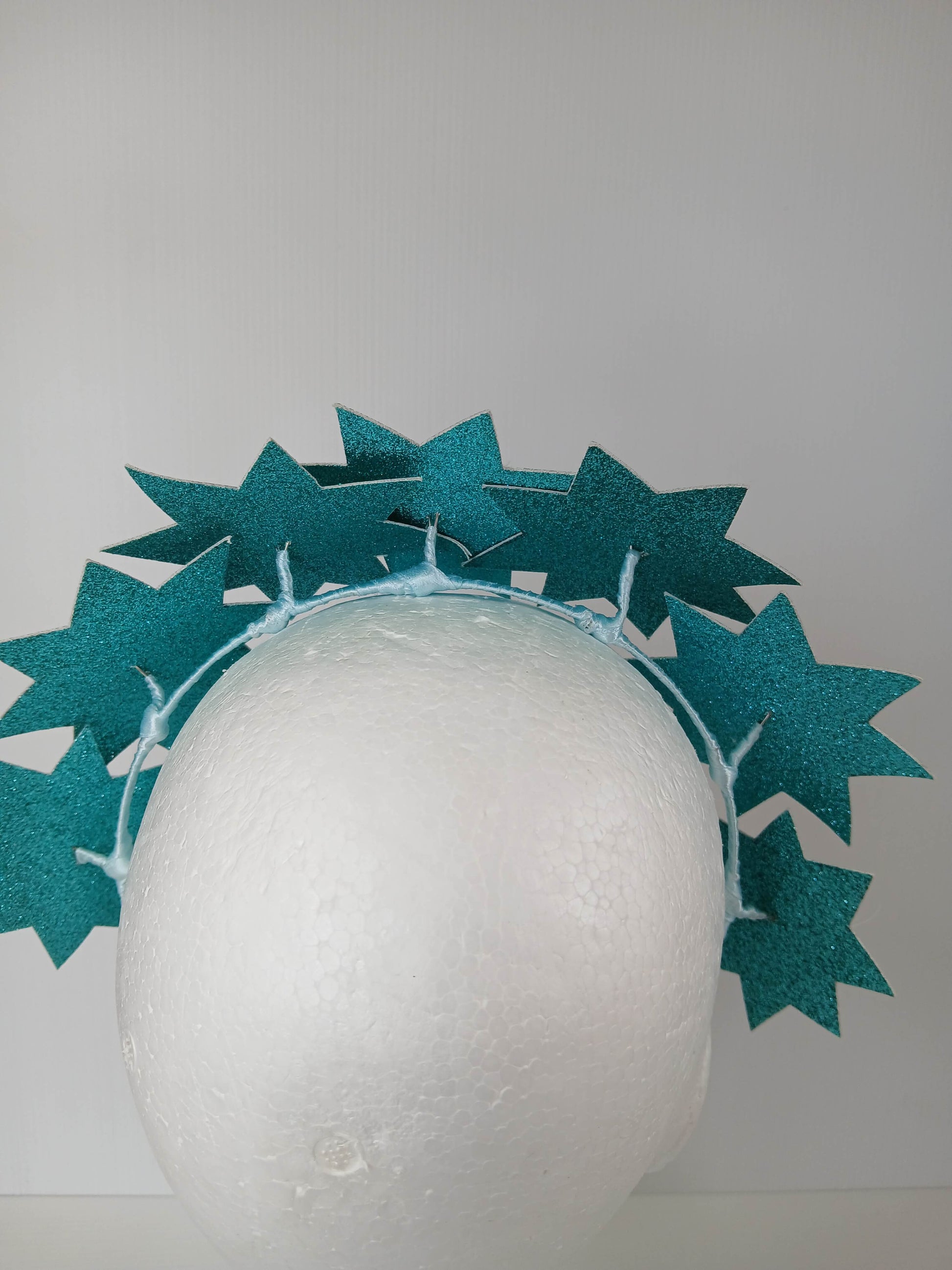 A picture of a Green Pleather Millinery Headband by Melissa Rath Millinery