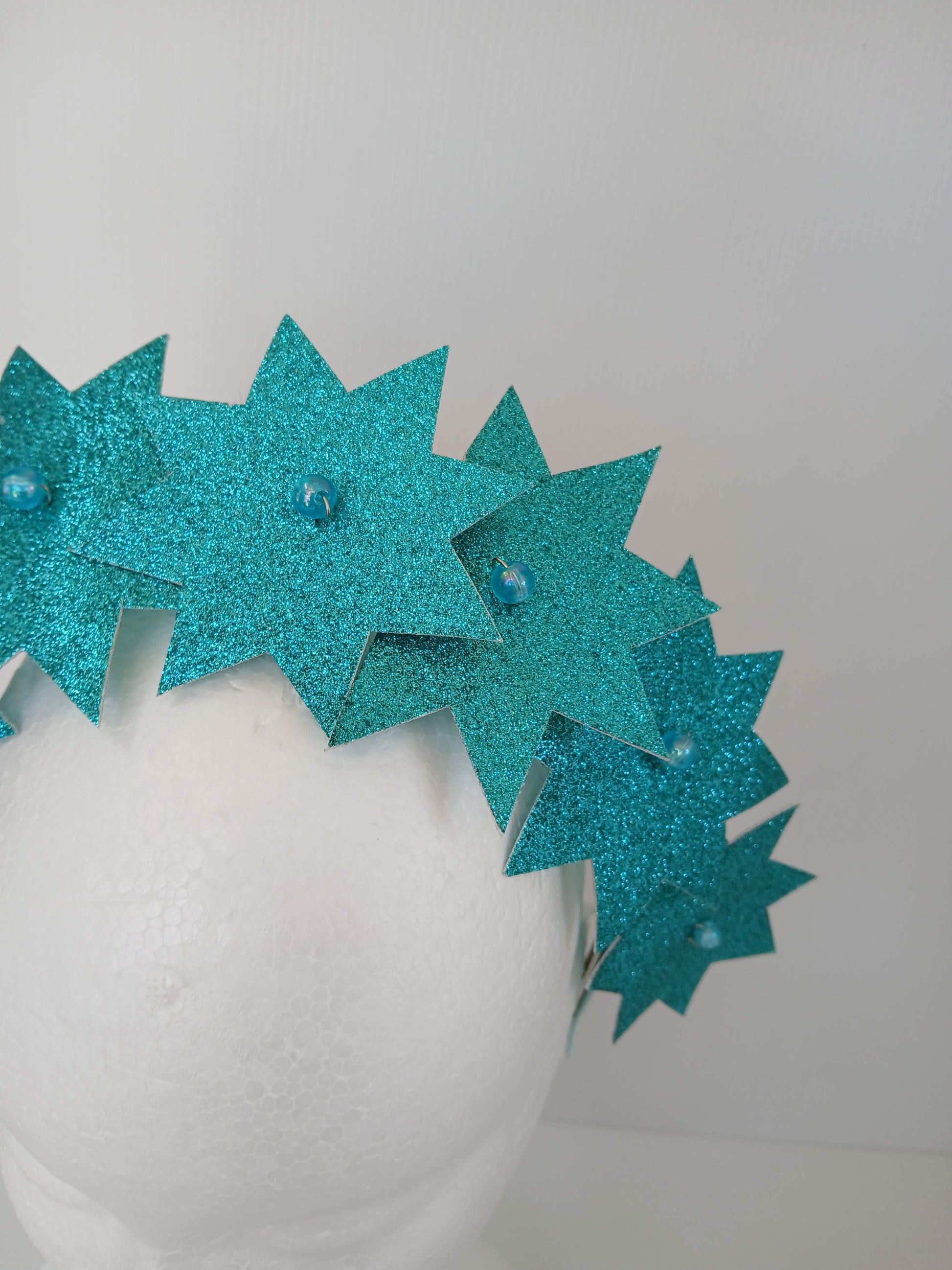 A picture of a Green Pleather Millinery Headband by Melissa Rath Millinery