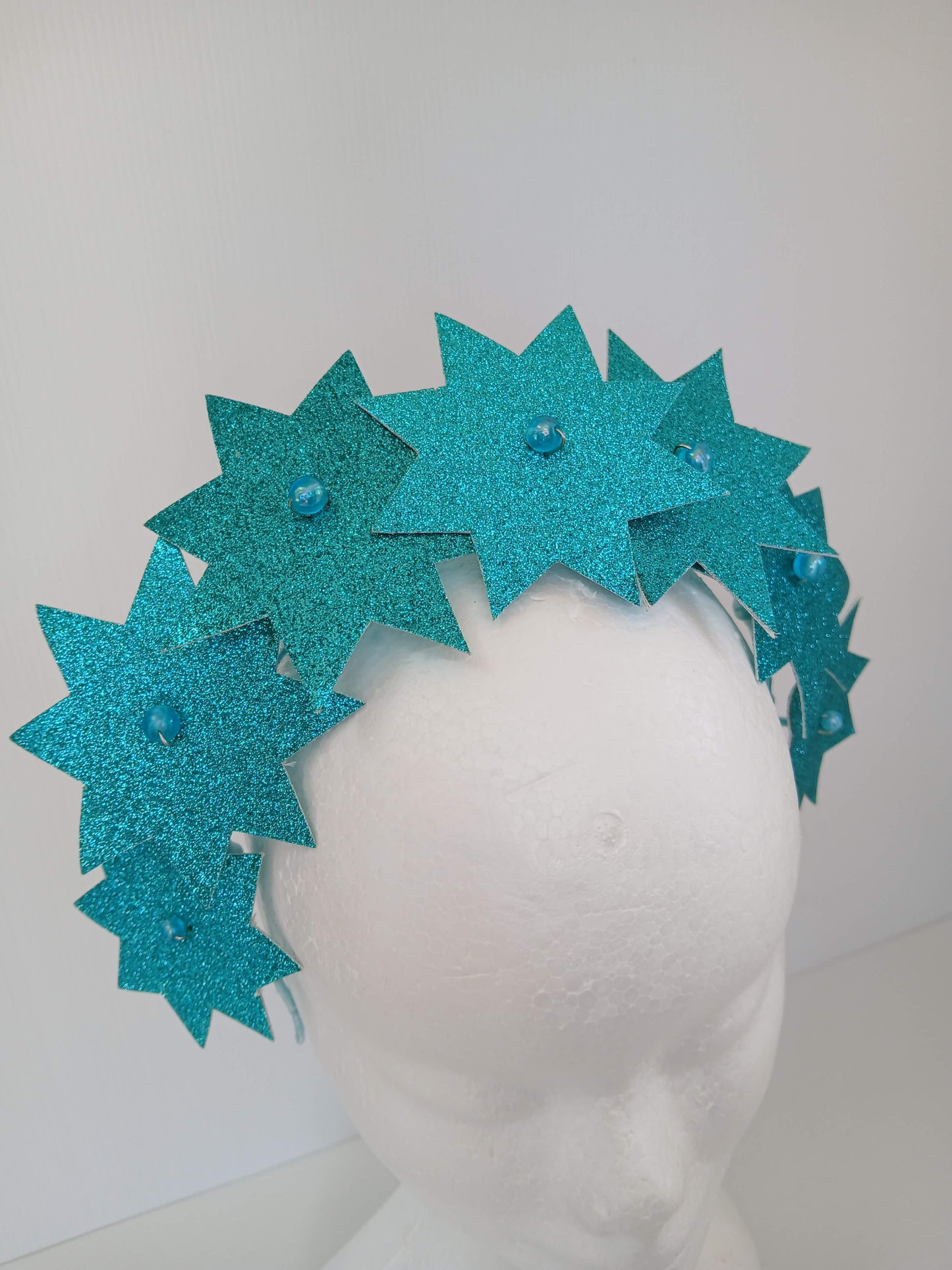 A picture of a Green Pleather Millinery Headband by Melissa Rath Millinery