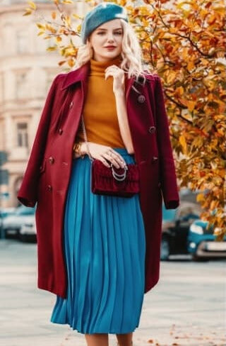 A picture of a woman wearing an outfit in a green triadic colour scheme.