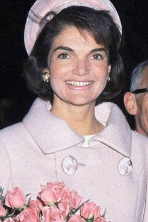 A picture of Jackie Kennedy in a pink pillbox.