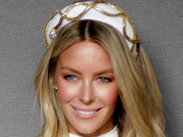 A picture of Jennifer Hawkins wearing a millinery crown.