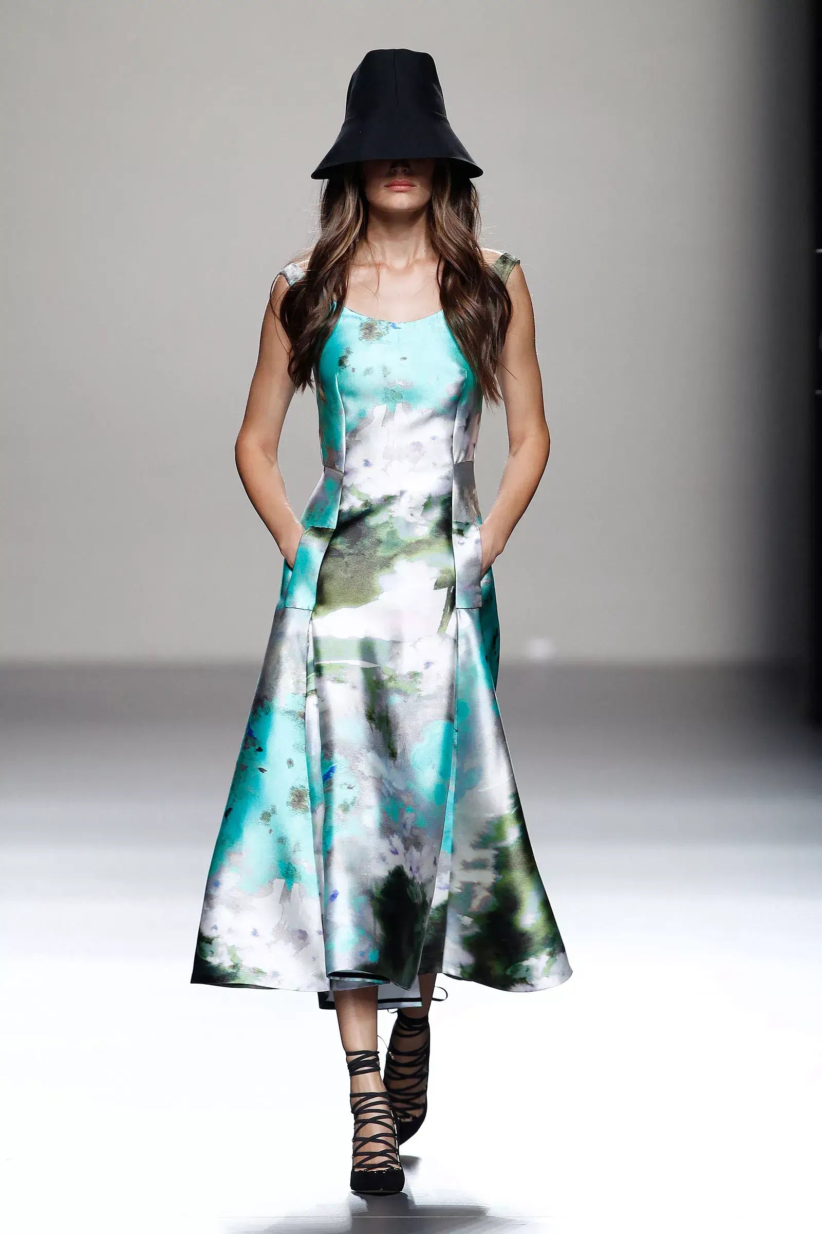 A picture of a model on the catwalk for  Juanjo Olivia SS 2014.