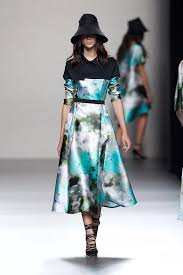 A picture of a model on the catwalk for  Juanjo Olivia SS 2014.