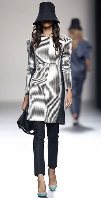 A picture of a model on the catwalk for  Juanjo Olivia SS 2014.
