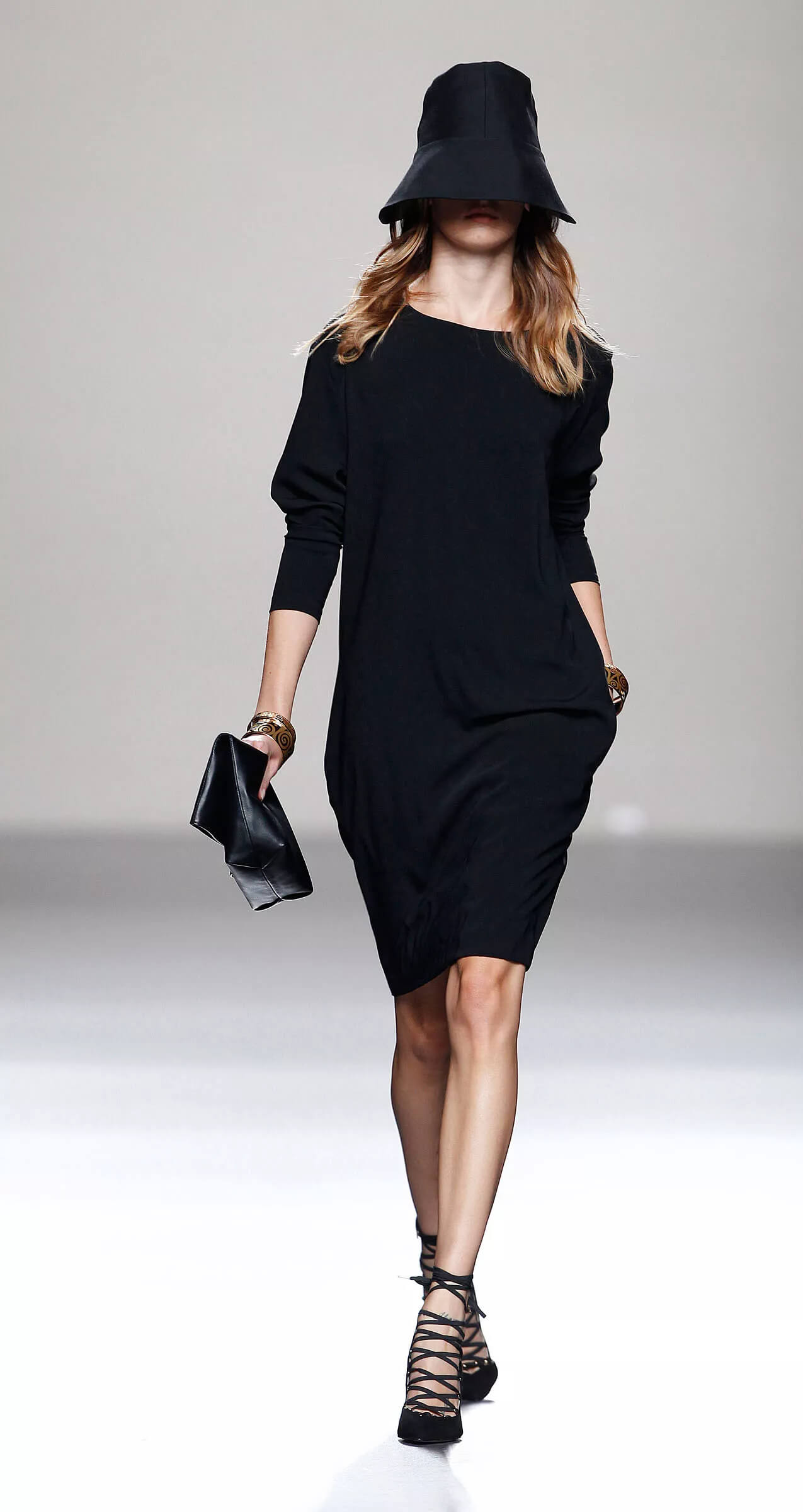 A picture of a model on the catwalk for  Juanjo Olivia SS 2014.
