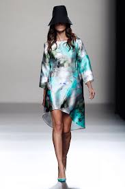 A picture of a model on the catwalk for  Juanjo Olivia SS 2014.