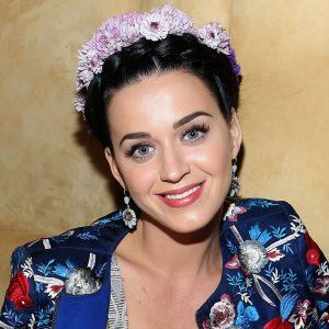A picture of Katy Perry wearing a millinery crown.