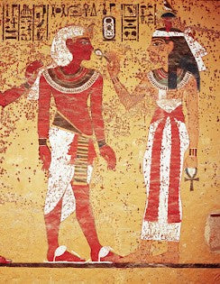 A painting of King Tut with a God on the inside of an Egyptian Tomb