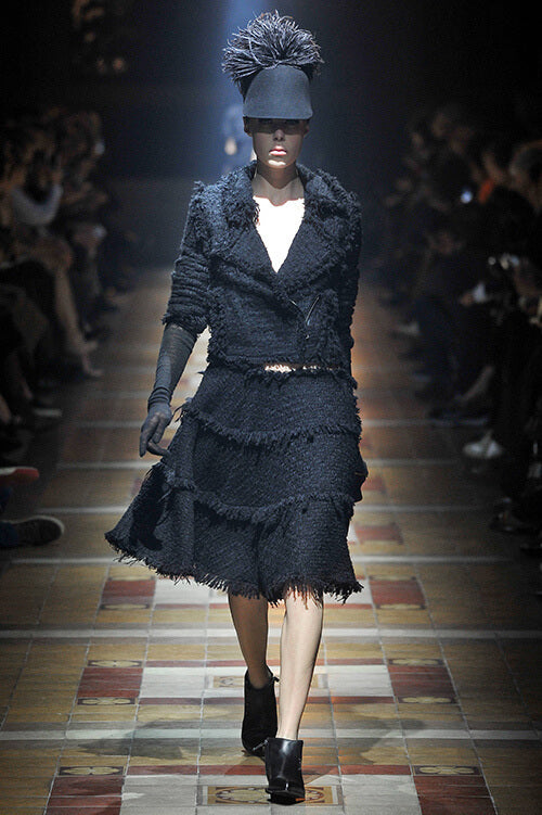 A picture of a model on the catwalk for  Lanvin AW 2014.