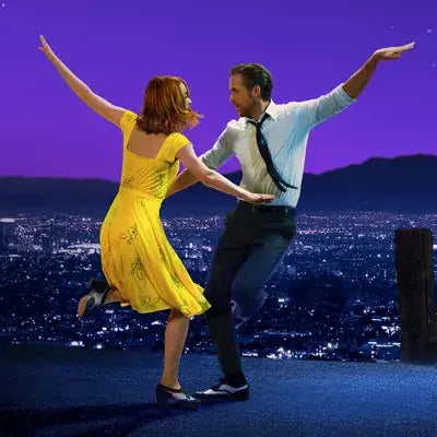 A picture of Emma Stone and Ryan Gosling dancing in the movie La La Land.