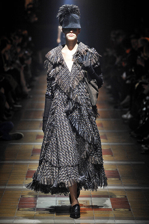 A picture of a model on the catwalk for  Lanvin AW 2014.