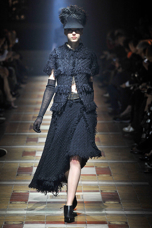 A picture of a model on the catwalk for  Lanvin AW 2014.