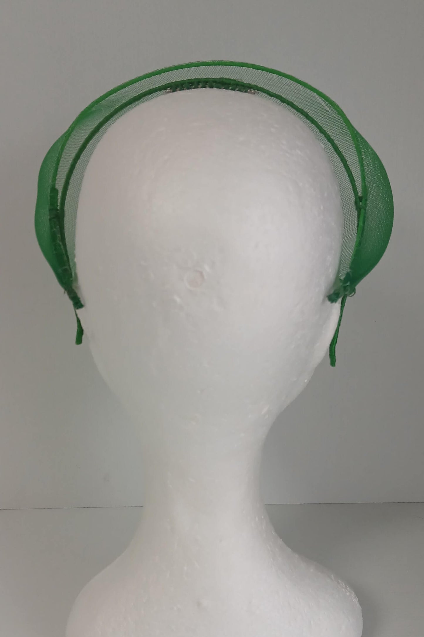 A picture of a green crinoline millinery veil by Melissa Rath Millinery