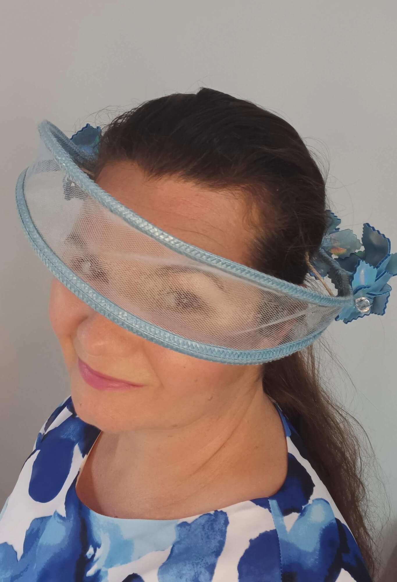 A picture of a Blue Tulle Floating Millinery Headpiece by Melissa Rath Millinery.