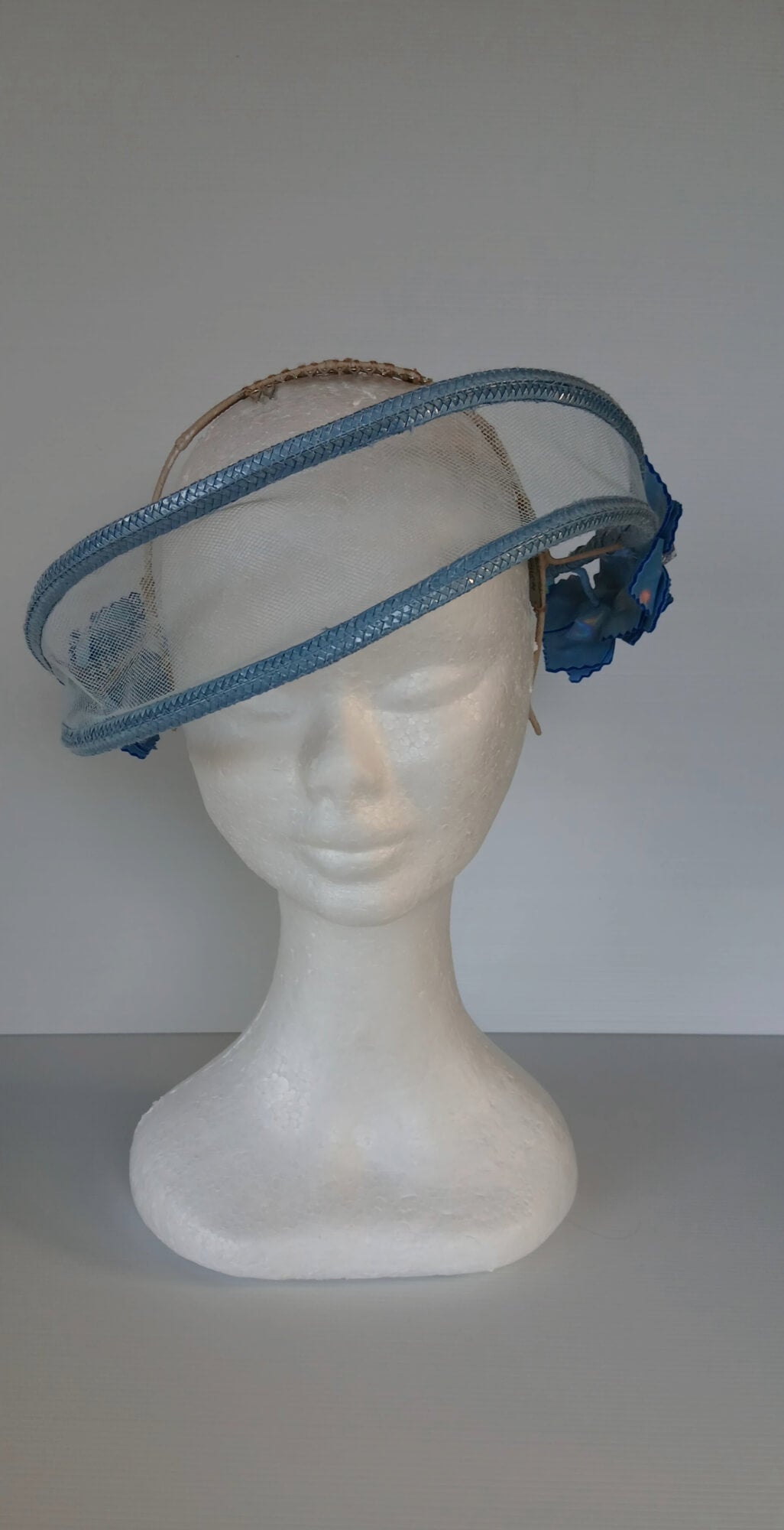 A picture of a Blue Tulle Floating Millinery Headpiece by Melissa Rath Millinery.