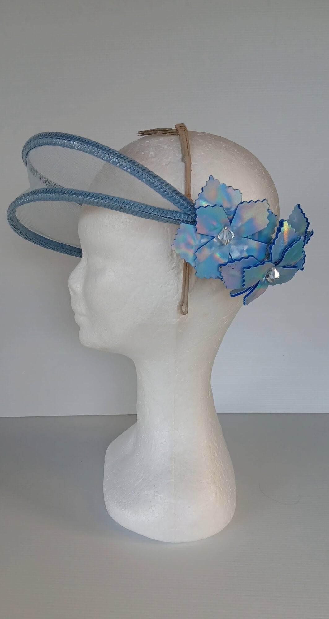 A picture of a Blue Tulle Floating Millinery Headpiece by Melissa Rath Millinery.