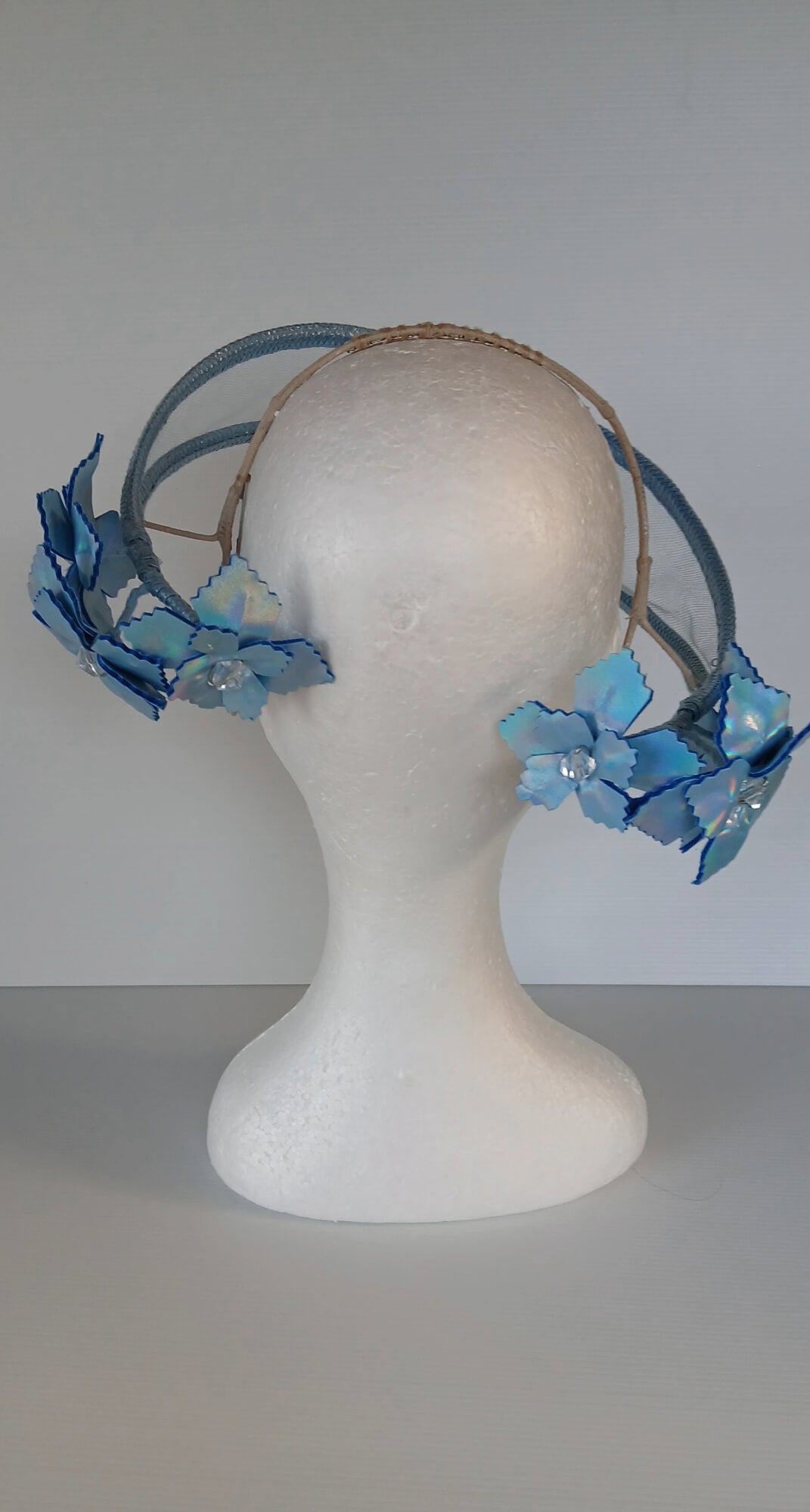 A picture of a Blue Tulle Floating Millinery Headpiece by Melissa Rath Millinery.