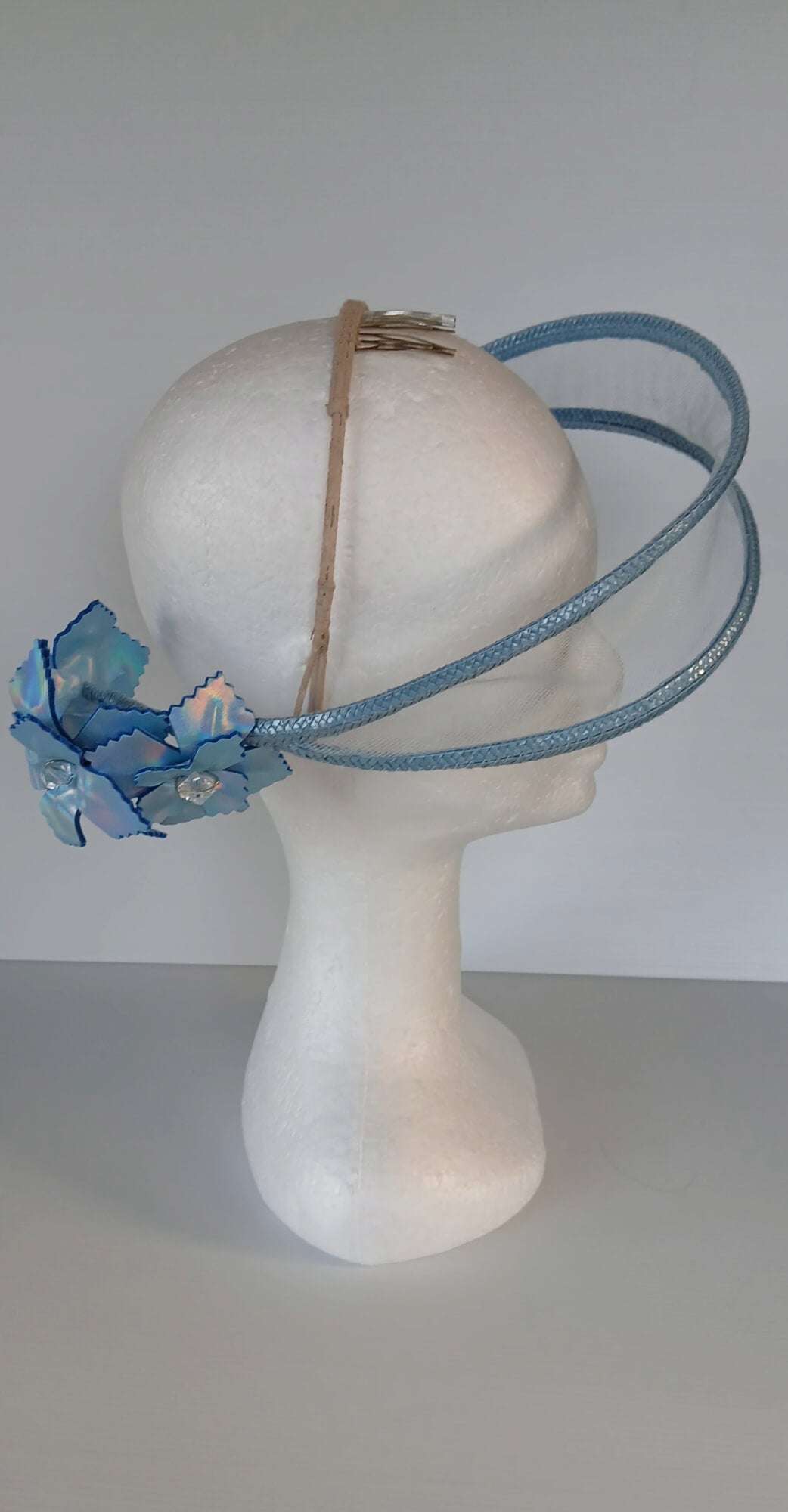 A picture of a Blue Tulle Floating Millinery Headpiece by Melissa Rath Millinery.