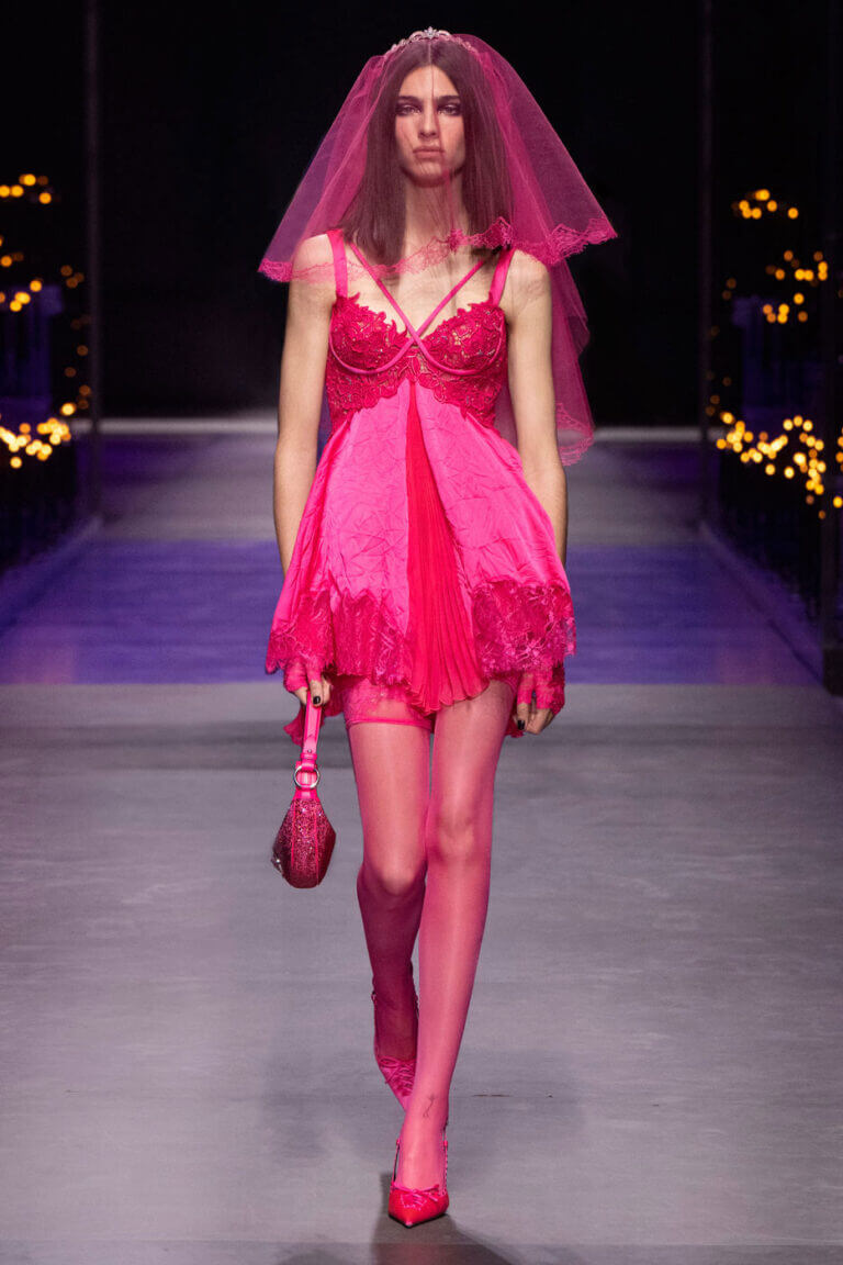 A picture of a model for Versace 2023 wearing pink