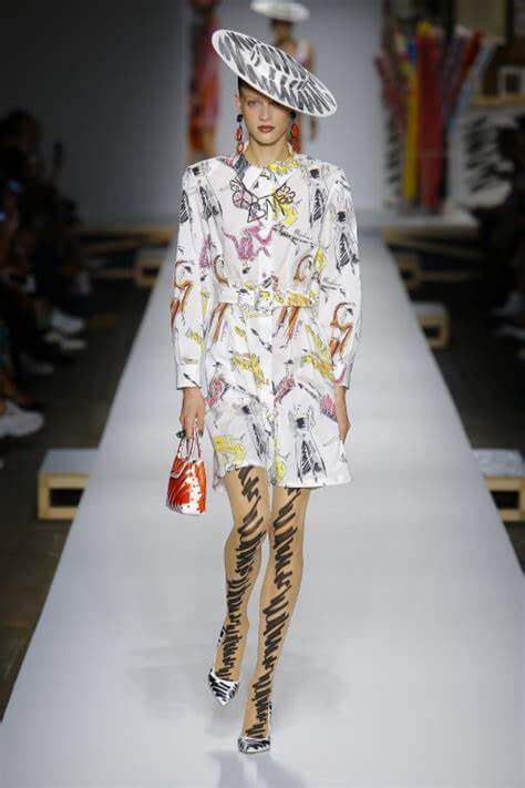A picture of a model on the catwalk for Moschino 2019.