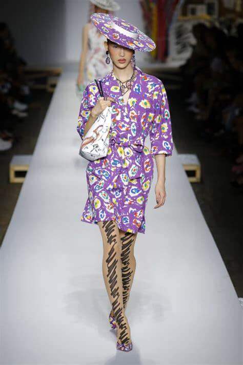A picture of a model on the catwalk for Moschino 2019.