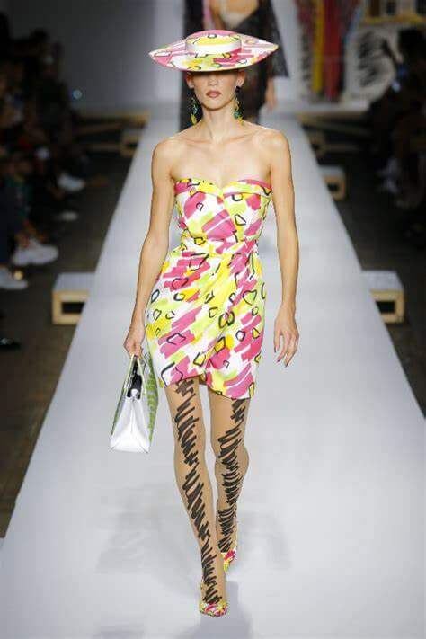 A picture of a model on the catwalk for Moschino 2019.