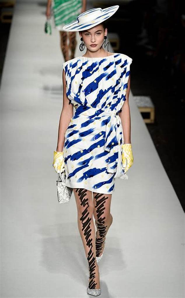 A picture of a model on the catwalk for Moschino 2019.