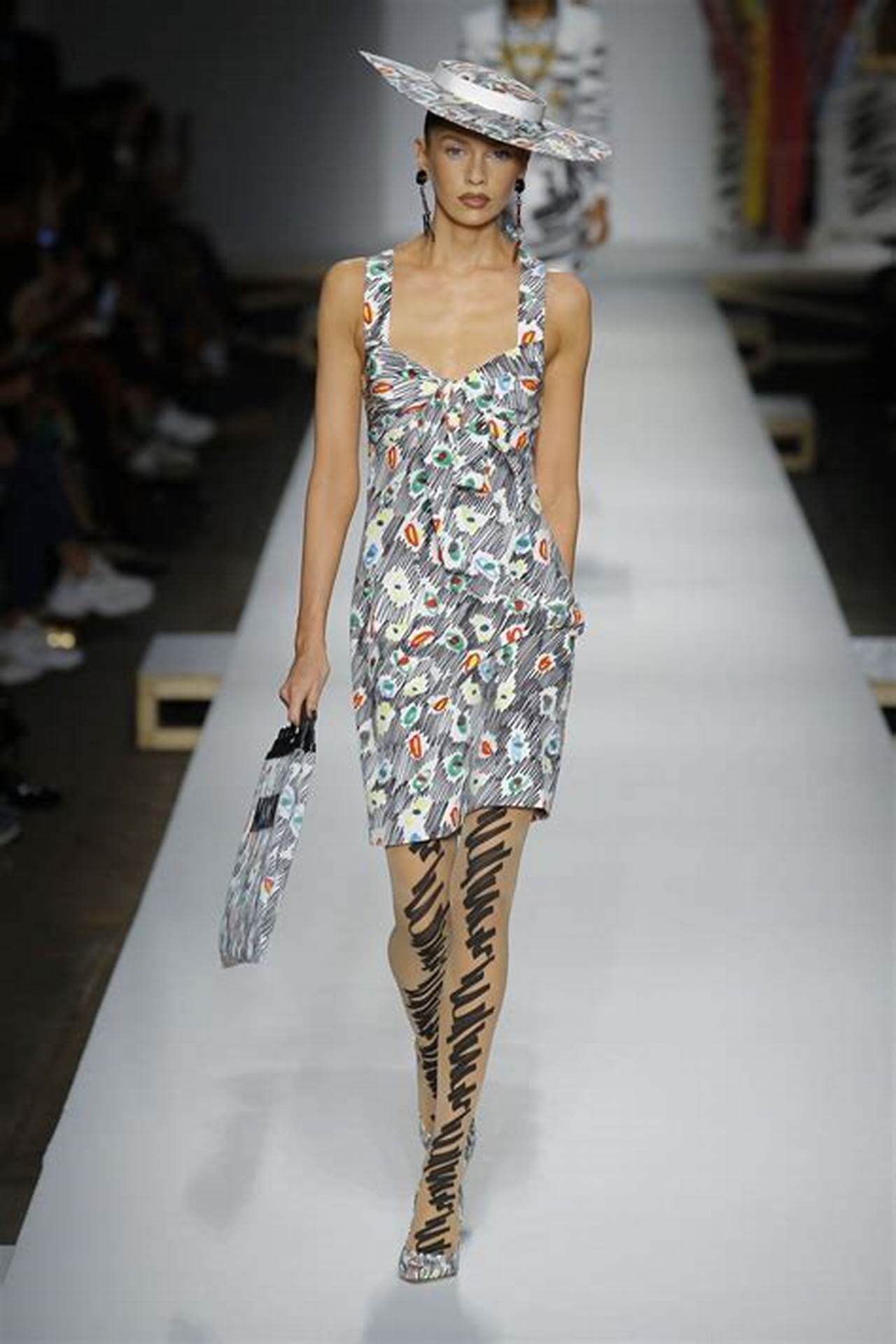 A picture of a model on the catwalk for Moschino 2019.