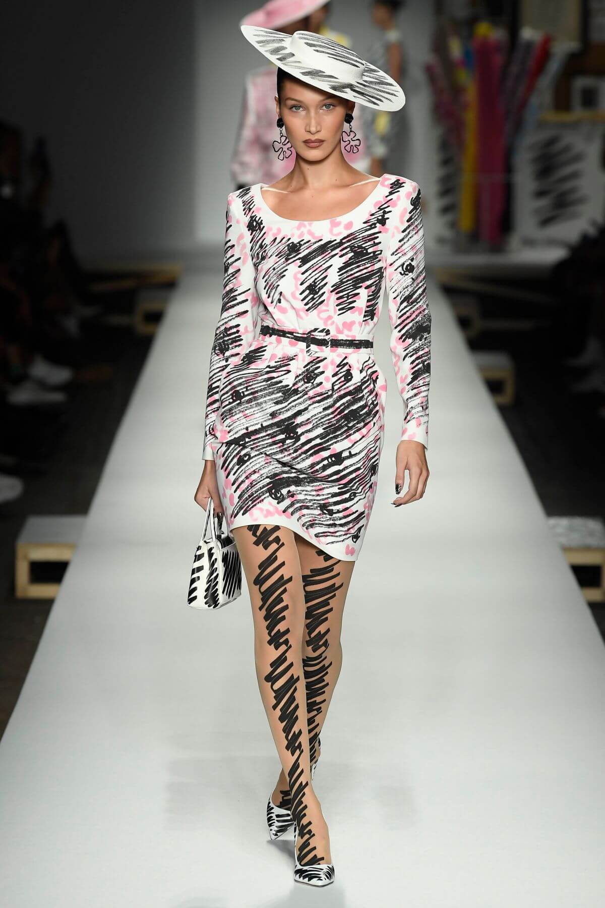 A picture of a model on the catwalk for Moschino 2019.