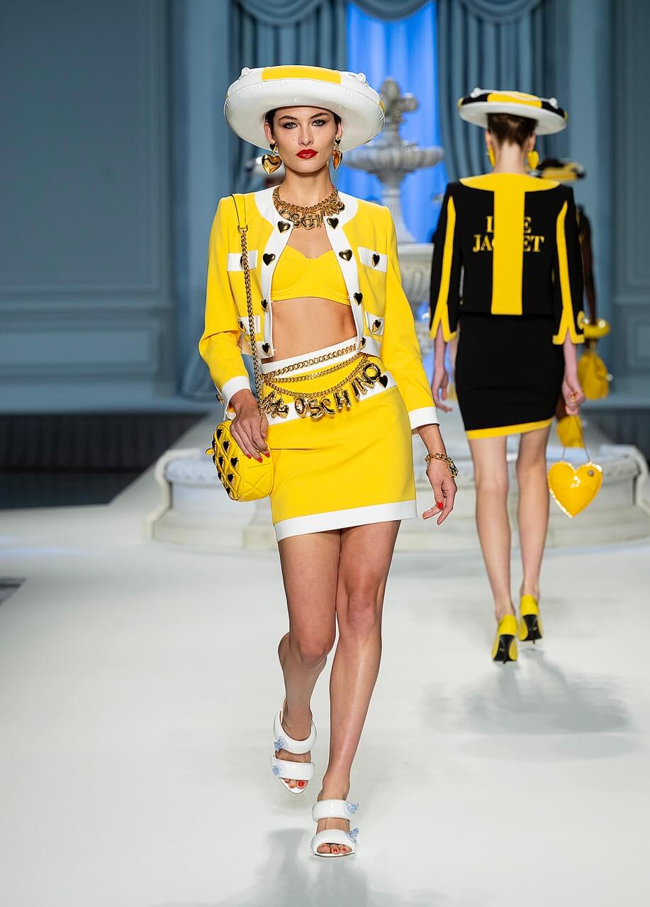A picture of a model on the catwalk for Moschino 2023.