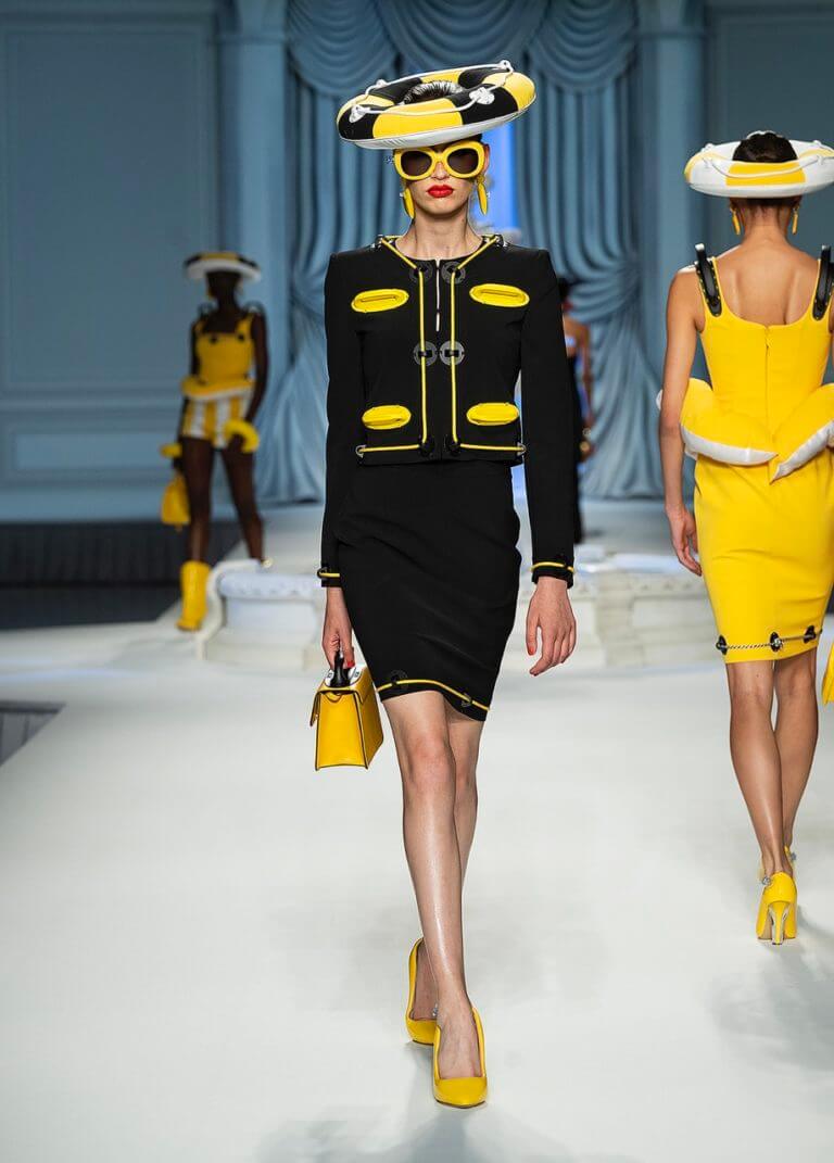 A picture of a model on the catwalk for Moschino 2023.