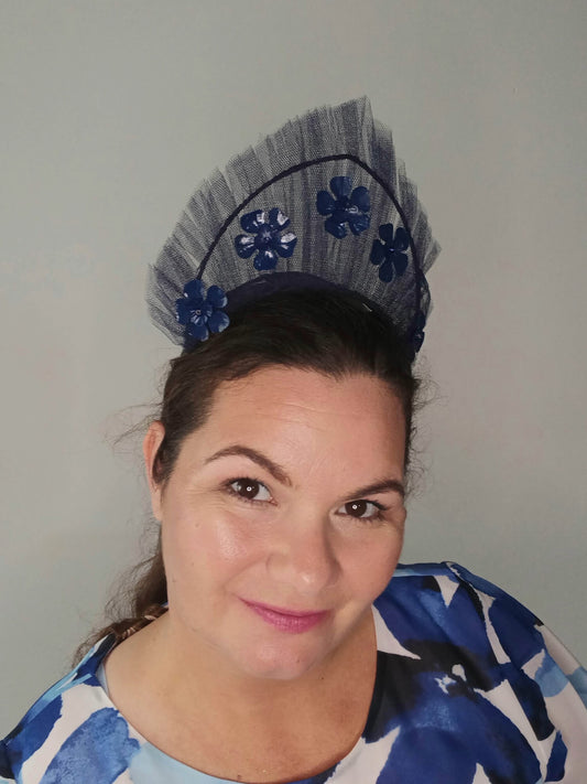 A picture of a Navy Tulle Crown by Melissa Rath Millinery .