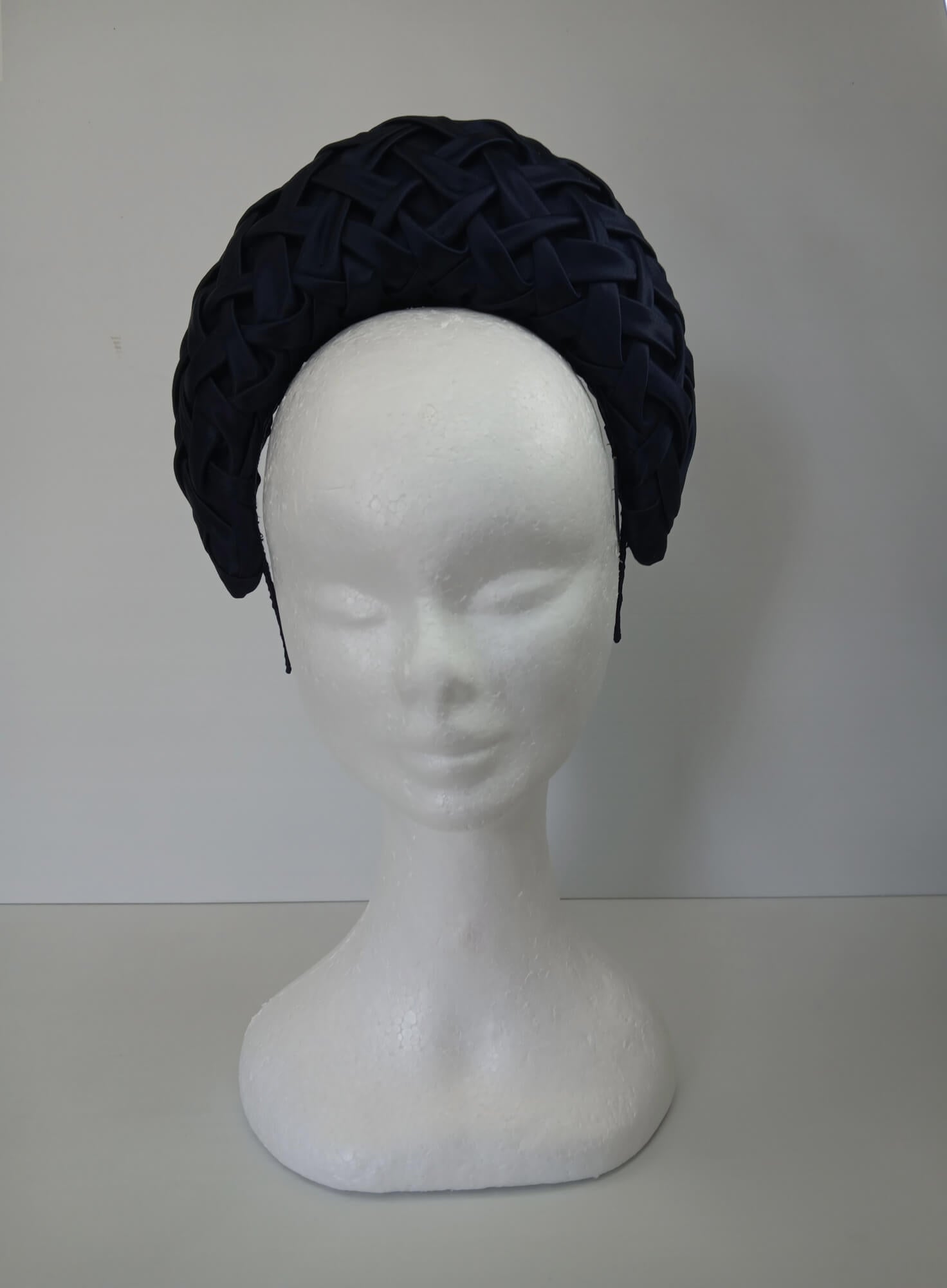 A picture of a Navy Blocked Smocked Millinery Crown by Melissa Rath Millinery