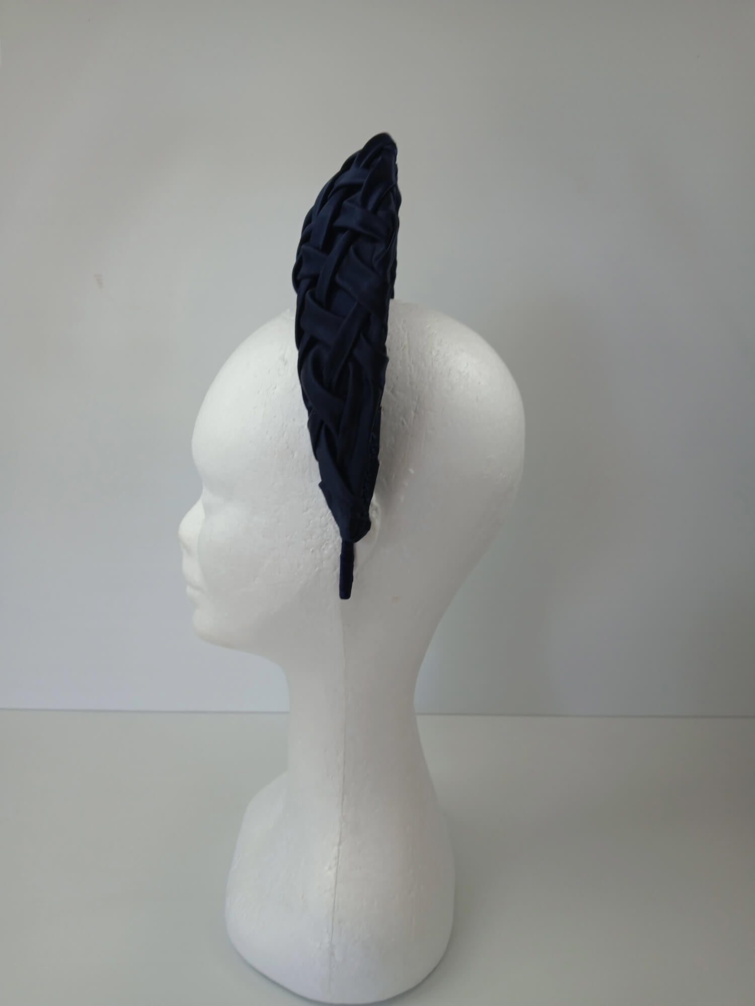 A picture of a Navy Blocked Smocked Millinery Crown by Melissa Rath Millinery