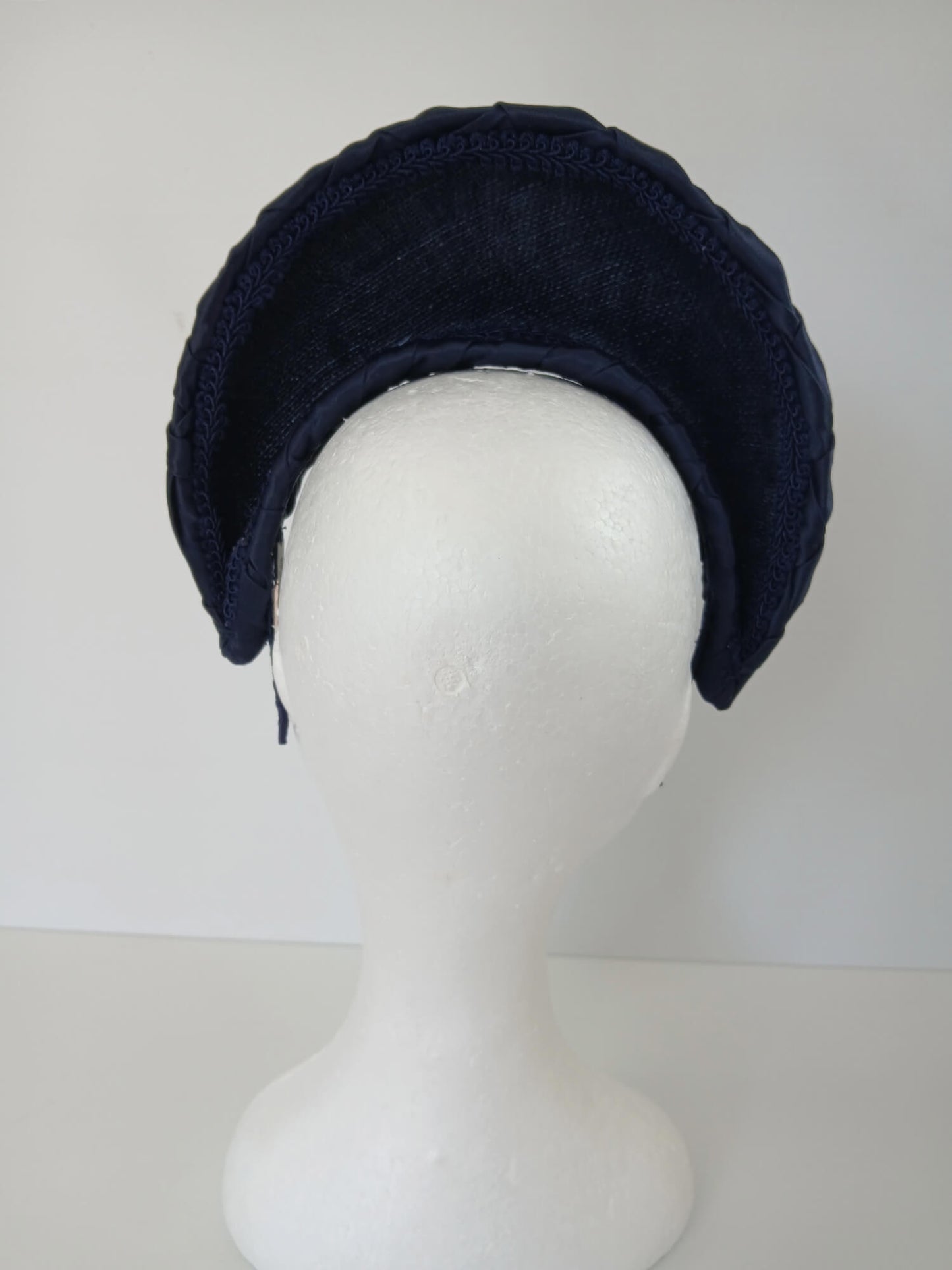 A picture of a Navy Blocked Smocked Millinery Crown by Melissa Rath Millinery