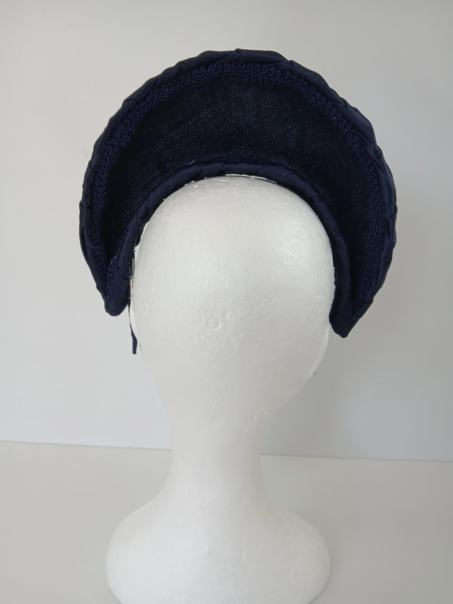A picture of a Navy Blocked Smocked Millinery Crown by Melissa Rath Millinery