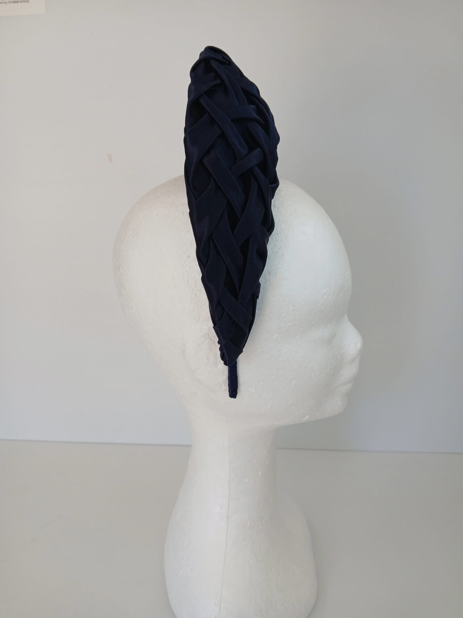 A picture of a Navy Blocked Smocked Millinery Crown by Melissa Rath Millinery