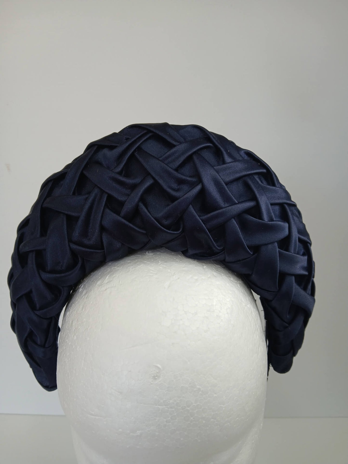 A picture of a Navy Blocked Smocked Millinery Crown by Melissa Rath Millinery