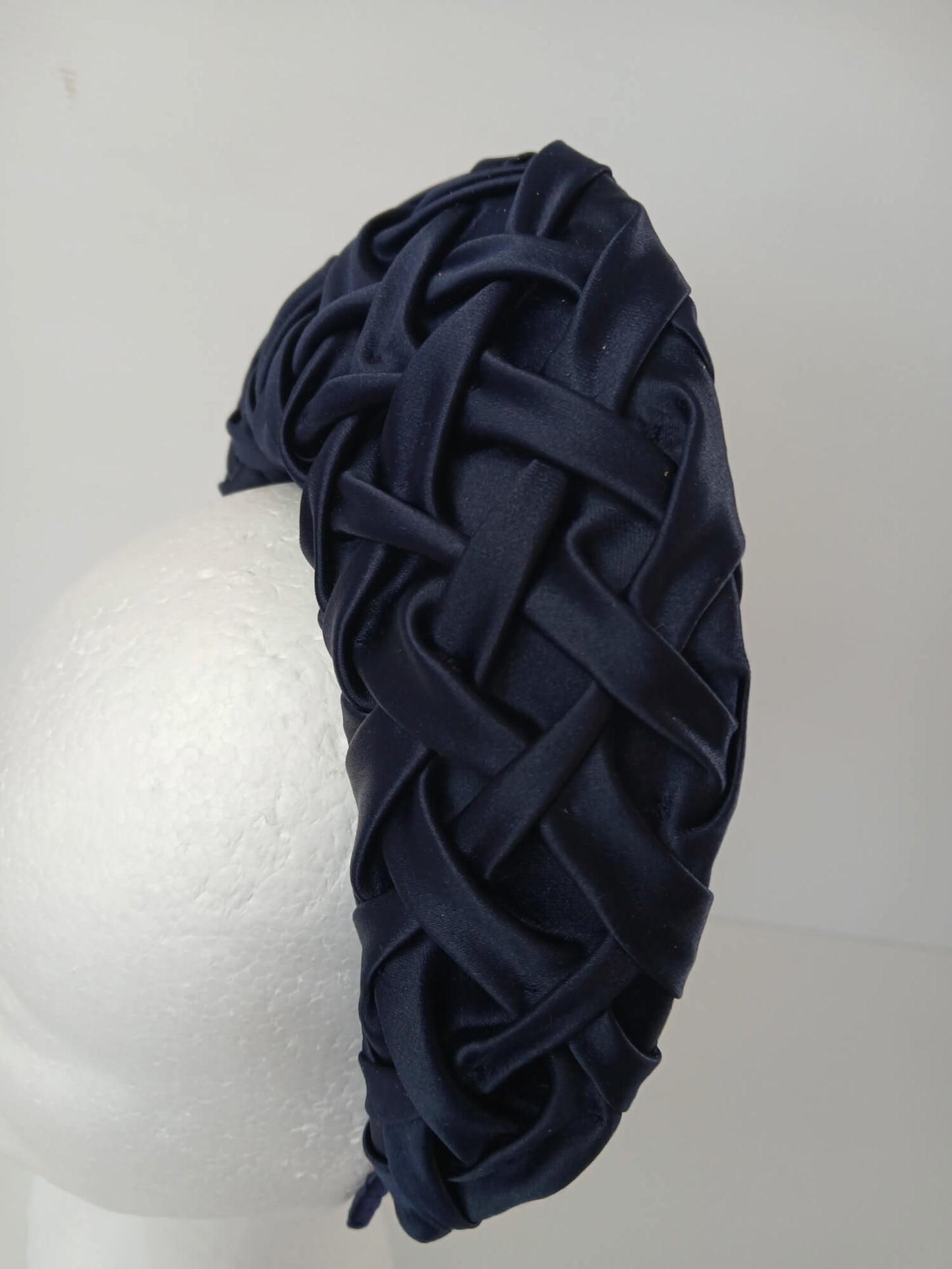 A picture of a Navy Blocked Smocked Millinery Crown by Melissa Rath Millinery