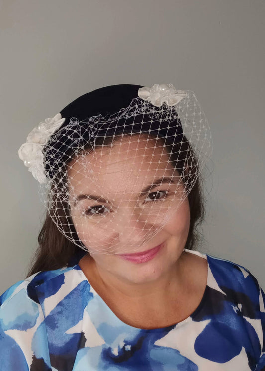 A picture of a Navy and White Veiled Velvet Millinery Fascinator by Melissa Rath Millinery.
