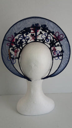 A picture of a Navy and Pink Beaded Crinoline Crown by Melissa Rath Millinery.